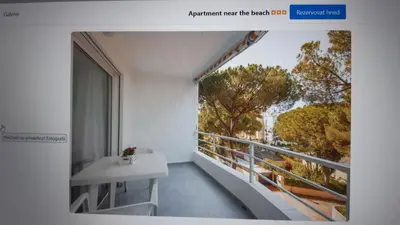 a room with a balcony with a table and a window at Apartment near the beach,Marbella in Mladá Boleslav