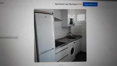 a kitchen with a white refrigerator and a dishwasher at Apartment near the beach,Marbella in Mladá Boleslav