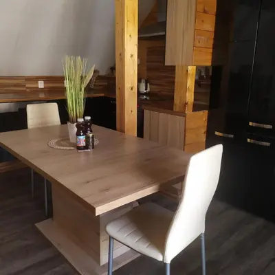 a bottle of wine sitting on top of a table at Magical apartment Dobříš in Dobříš
