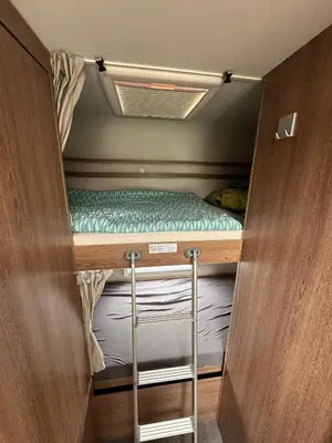 a small room with two bunk beds in it at Hotel na kolech in Kladno