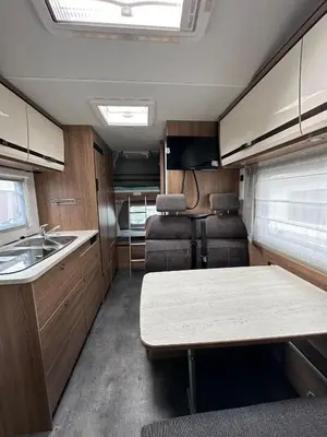 an rv kitchen with a table and a sink at Hotel na kolech in Kladno