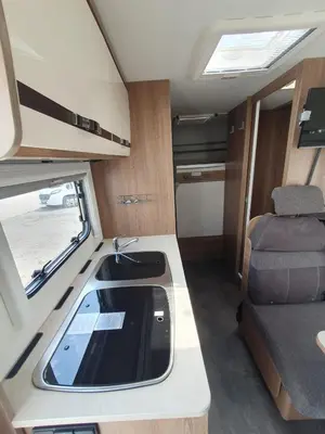 a small kitchen with a sink in an rv at Hotel na kolech in Kladno