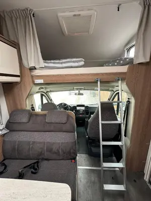 an interior view of an rv with two bunk beds at Hotel na kolech in Kladno