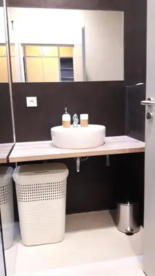 a bathroom with a sink and a mirror at Hotel & Hostel Letov in Prague