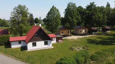 an aerial view of a village with a house at Centrální chata Kanoistika Roudnice in Vědomice