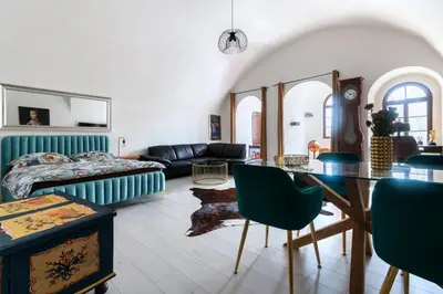 a living room with a couch and a table at Apartmán Hradčany 7 in Prague