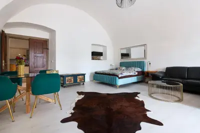 a living room with a couch and a table at Apartmán Hradčany 7 in Prague