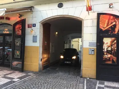 a car parked in a tunnel in a street at The Old town's apartment in Prague