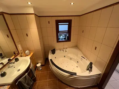 a large bathroom with a tub and a sink at The Old town's apartment in Prague