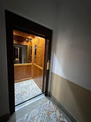 a dark wooden door in a room with a rug at Arbes 14 - Mirror of Prague in Prague