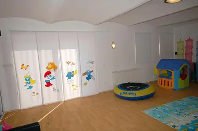 a room with a room with a play room with a toy at Příjemné místo pro odpočinek s bazeném in Radovesice