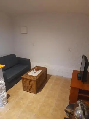 a living room with a couch and a coffee table at Ubytování Ždírec - Apartmán 3 in Doksy