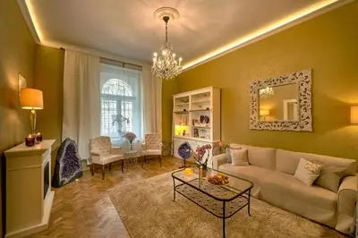 a living room with a couch and a table at Amethyst apartment in Prague