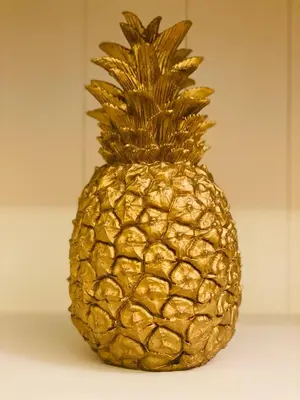 a gold pineapple sitting on top of a table at Amethyst apartment in Prague