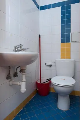 a bathroom with a sink and a toilet at Roosevelt Hostel in Prague
