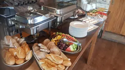 a buffet with a bunch of different types of food at Penzion Eška s Pivovarem MJ in Jince