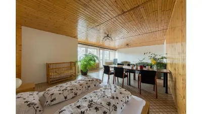 a living room with a dining room table and chairs at Apartmán Vrané in Vrané nad Vltavou