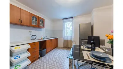 a kitchen with a counter and a table in it at Apartmán Vrané in Vrané nad Vltavou