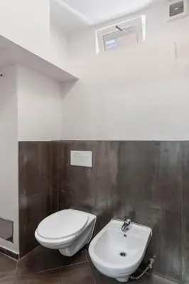 a bathroom with a toilet and a sink at Apartment Golden Stage Nook by Interhome in Prague