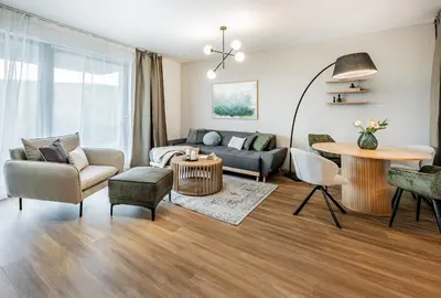 a living room with a couch and a table at Radlické výhledy in Prague