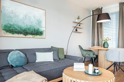 a living room with a couch and a table at Radlické výhledy in Prague