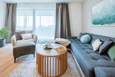a living room with a couch and a coffee table at Radlické výhledy in Prague