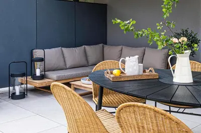 a table and chairs with a couch in a living room at Radlické výhledy in Prague