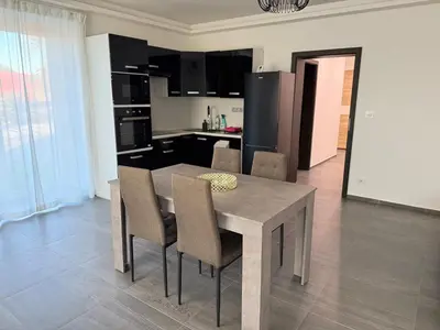 a kitchen and dining room with a table and chairs at Byt apartman 72m2 private garden PARKING FREE in Prague