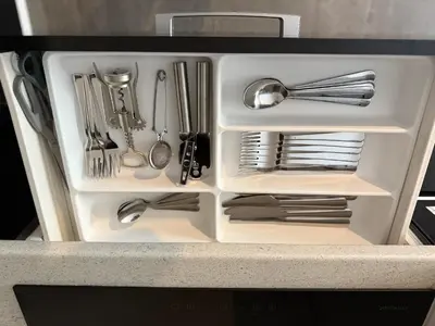 a white drawer filled with utensils in a refrigerator at Byt apartman 72m2 private garden PARKING FREE in Prague