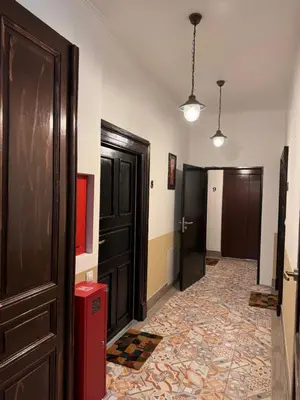 a hallway with two doors and a red box at 8- Little Prague Home in Prague