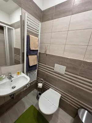 a bathroom with a toilet and a sink at 8- Little Prague Home in Prague