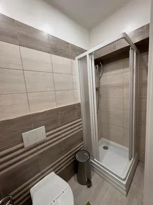 a bathroom with a toilet and a shower at 8- Little Prague Home in Prague