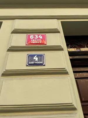 a sign on the side of a building at 8- Little Prague Home in Prague