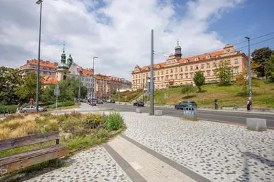 a street in a city with buildings and a road at Blueground Rostovska str renovated furnished PRG-19 in Prague