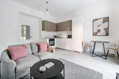 a living room with a couch and a table at Blueground Vršovice private terrace equipped PRG-4 in Prague