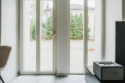 an open glass door with a view of a yard at Blueground Vršovice private terrace equipped PRG-4 in Prague