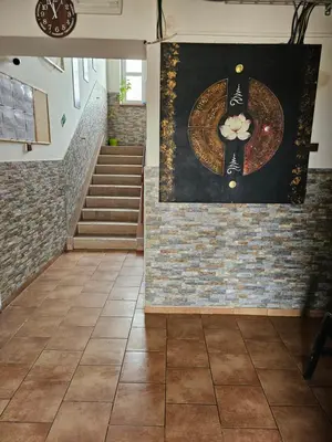 a room with a painting on the wall and stairs at Ubytovna-Hostel- IMOS in Prague