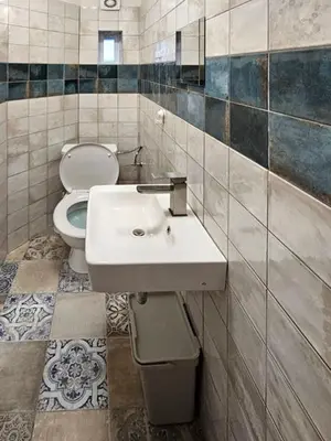 a bathroom with a sink and a toilet at Ubytovna-Hostel- IMOS in Prague