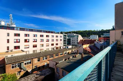 a view of a city from a balcony with buildings at Tiger Deluxe Suite in Prague
