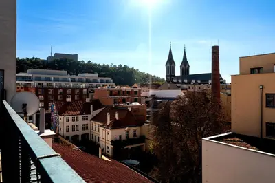 a view of a city with buildings and a church at Tiger Deluxe Suite in Prague