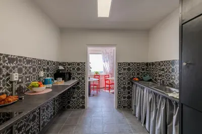 a kitchen with black and white wallpaper and a counter at Cooliving in Prague