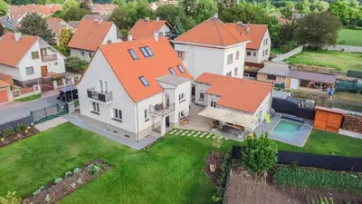 an aerial view of a house with an orange roof at Mezidomí in Budyně nad Ohří