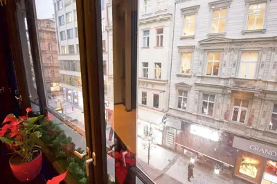 a window with a view of a city at Apartment in the heart of Prague in Prague