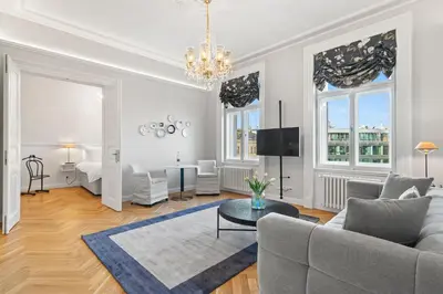 a living room with a couch and a table at Vodickova Luxury Suites in Prague