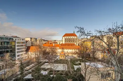 a view of a city with buildings and trees at Vodickova Luxury Suites in Prague