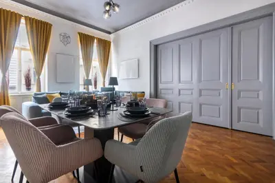 a dining room with a table and chairs at 3 Bedroom - Central Superior-Flat 115m2 in Prague