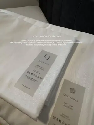 two white towels sitting on top of a table at SYMPHONY No 501 Apartment MyMozart in Prague