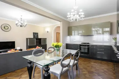 a kitchen with a table and chairs and a dining room at Academia in Prague