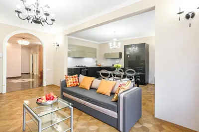 a living room with a couch and a table at Academia in Prague