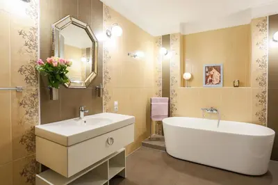a bathroom with a sink and a tub and a mirror at Academia in Prague